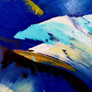 May include: Abstract painting with thick brushstrokes in shades of blue, turquoise, yellow, and white. The artwork features a textured surface, with visible paint layers creating a dynamic and expressive composition. The colors blend and contrast.