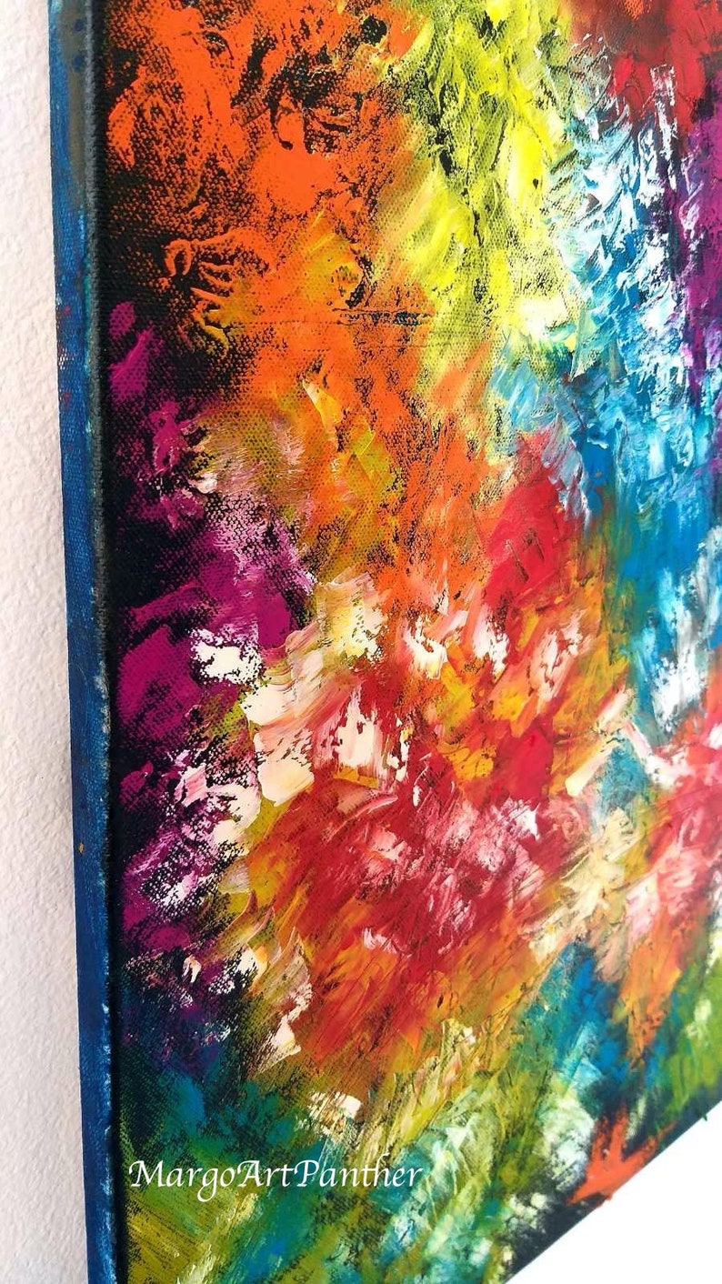 May include: Abstract painting with thick brushstrokes in vibrant colors. The artwork features a mix of orange, yellow, red, blue, and purple hues. The canvas has a blue border and the artist's signature, "MargoArtPanther", is visible.