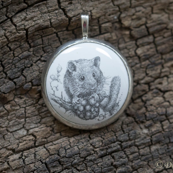Enamel jewelry pendant with a drawn hazel mouse, set in silver