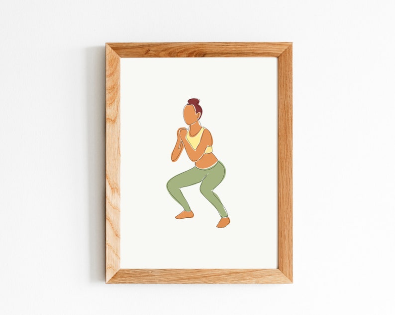 May include: Line art illustration of a person in a yellow sports bra and green pants doing a squat exercise. The illustration is framed in a light wood frame.
