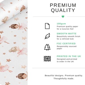 May include: Wrapping paper featuring a repeating pattern of illustrated ballerinas in pink tutus and tan stars on a white background. Text includes PREMIUM QUALITY, 100gsm, SMOOTH MATTE, FSC CERTIFIED, and PRINTED IN THE UK with icons for paper, feather, trees, and flag.