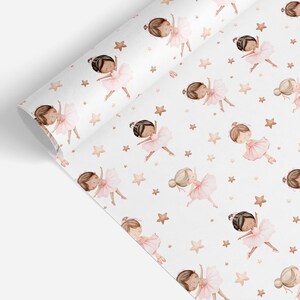 May include: A roll of white wrapping paper featuring a repeating pattern of watercolor-style illustrations of ballerinas wearing pink tutus and ballet slippers, interspersed with small, light brown five-pointed stars across the surface.