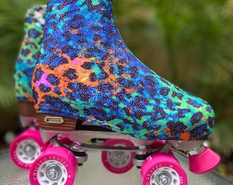 May include: A pair of roller skates with pink wheels and a blue, green, and orange leopard print boot cover. The wheels have the text "Chicago Skates 400" printed on them.