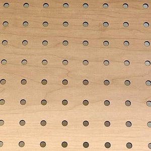 May include: A close-up of a light brown pegboard with evenly spaced holes. The holes are circular and have a light gray interior. The wood grain is visible, adding texture to the surface. The pegboard is designed for organization and display.