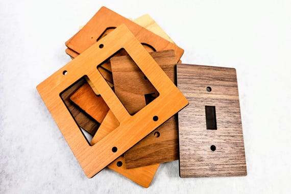 Clearance wood switch and outlet plates