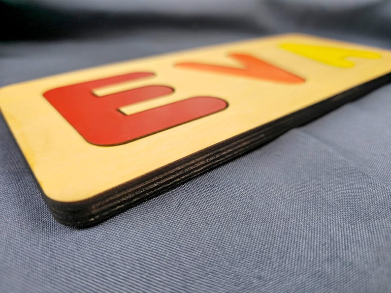 Custom wooden name sign with colorful inlaid letters