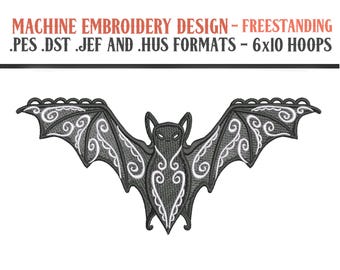 May include: Machine embroidery design of a black bat with white swirls on its wings. The design is freestanding and comes in .pes, .dst, .jef, and .hus formats. It is suitable for 6x10 hoops.