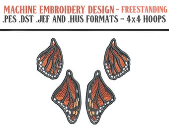 May include: Machine embroidery design featuring four orange and black butterfly wing patterns. The wings have detailed stitching and are set against a white background. The text at the top reads "MACHINE EMBROIDERY DESIGN - FREESTANDING .PES .DST .JEF AND .HUS FORMATS - 4x4 HOOPS."
