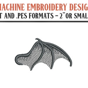 May include: A gray embroidered design of a single wing, suitable for machine embroidery. The design is 2 inches or smaller and available in .DST and .PES formats.