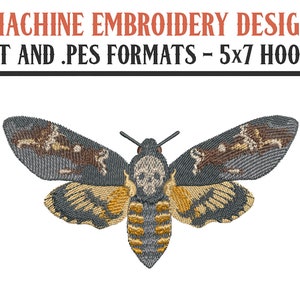 May include: Machine embroidery design of a gray and yellow moth with a skull pattern on its head. The design is available in .DST and .PES formats and is suitable for 5x7 hoops.