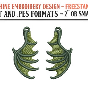 May include: Two green dragon wing embroidery designs in .DST and .PES formats, suitable for machine embroidery. The designs are freestanding and measure 2 inches or smaller.