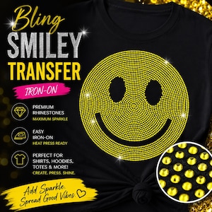 May include: Black t-shirt featuring a large, yellow rhinestone smiley face design. The image includes text that reads "Bling Smiley Transfer Iron-On" and "Add Sparkle. Spread Good Vibes."