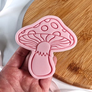 May include: Pink silicone mushroom-shaped cookie cutter.
