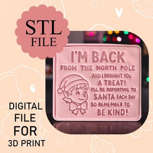 May include: A pink digital file for 3D printing. The design features the text "I'M BACK FROM THE NORTH POLE AND I BROUGHT YOU A TREAT! I'LL BE REPORTING TO SANTA EACH DAY SO REMEMBER TO BE KIND!" and an elf illustration.