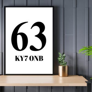 May include: Black and white framed print with the number 63 and the text "KY7 ONB".