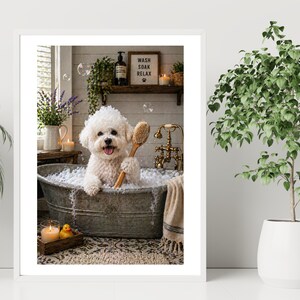 May include: A framed print showing a white dog in a metal tub filled with bubbles, holding a brush. A sign says "Wash Soak Relax". The scene includes candles, a rubber duck, and a plant. The tub is made of galvanized metal.