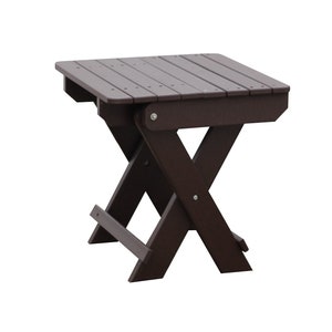 May include: A dark brown folding end table with a square top and an X-shaped base.
