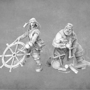 May include: Two miniature figures, one holding a ship's wheel and the other using a hand drill. The figures are painted in a light gray color and are posed in a dynamic action.