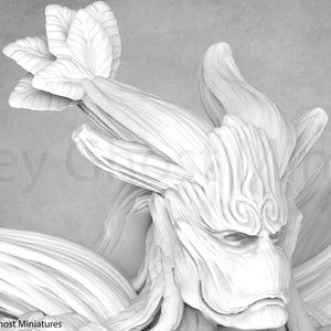 May include: A white, detailed, 3D printed miniature of a tree creature with a face and a leafy crown. The creature has a textured, bark-like surface and intricate details on its face.