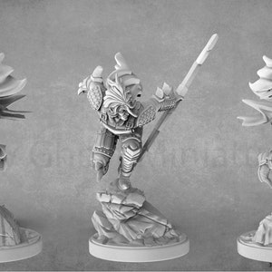 May include: A 3D printed miniature of a hooded figure in a dynamic pose, wearing armor and holding a weapon. The figure is standing on a rocky base.
