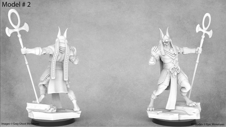 May include: A white painted miniature figurine of a jackal-headed deity holding a staff with an ankh symbol. The figure is posed in a dynamic stance with one leg forward and the other leg back. The figure is wearing a loincloth and a headdress with a jackal head.