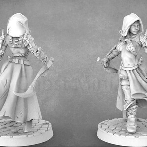 May include: A white 3D printed miniature of a female figure wearing a hooded cloak and armor, holding a weapon in each hand. The figure is standing on a circular base with a cobblestone design. The miniature is unpainted.