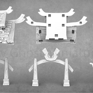 Op de afbeelding: Een set van 3D-geprinte miniaturen van bouwdelen, waaronder een dak, muren, een poort en een boom. De onderdelen zijn wit en hebben een getextureerd oppervlak.