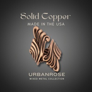 The image is an advertisement for Solid Copper jewelry, specifically Urbanrose mixed metal collection. The jewelry is made in the USA and features a solid copper design with a unique, swirling pattern.