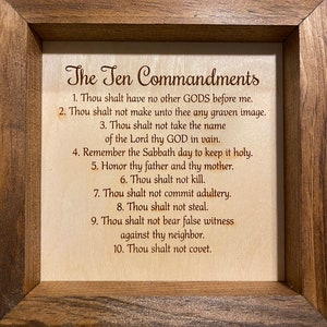 May include: A framed wooden sign with the Ten Commandments written in brown text on a light wood background.