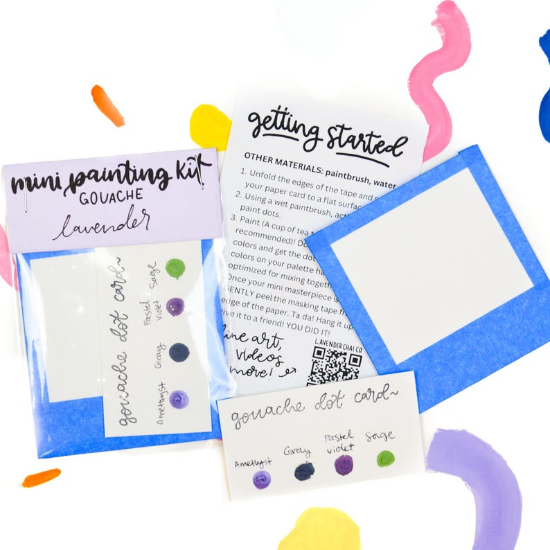 May include: A mini gouache painting kit with lavender paint and a dot card with six different colors: amethyst, gray, violet, pastel, sage, and a dark blue color. The kit includes instructions on how to get started with the paint.