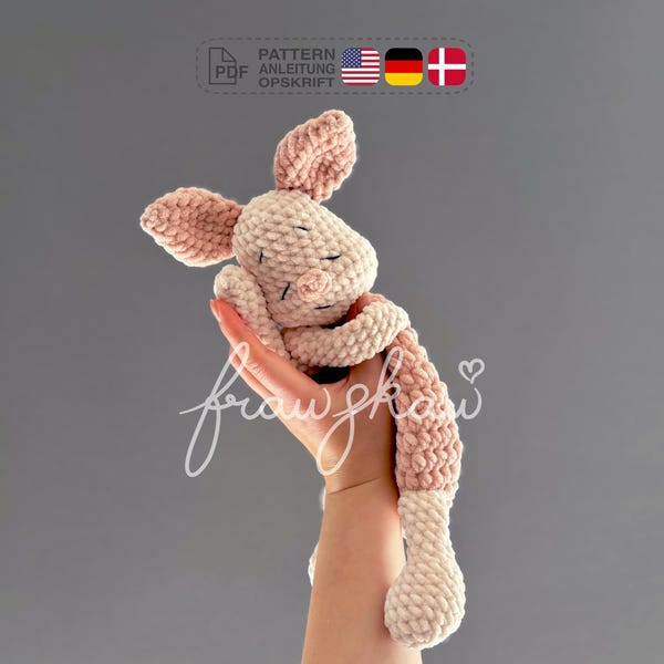 Molde de crochê para aconchegar um porquinho, em formato PDF, em inglês (termos americanos), alemão e dinamarquês.