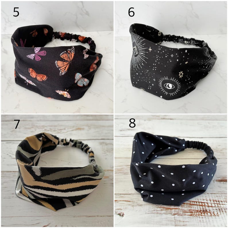 May include: Four fabric headbands with elastic back bands. Number 5 is black with orange and purple butterflies. Number 6 is black with white celestial eye and star patterns. Number 7 has tan, gray, and black stripes. Number 8 is black with white polka dots.