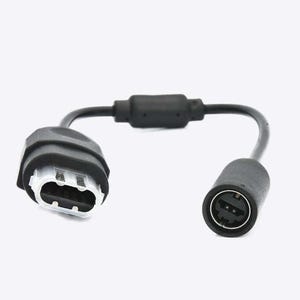May include: Black video game controller adapter with two connectors. One connector is a standard controller connector and the other is a smaller connector.
