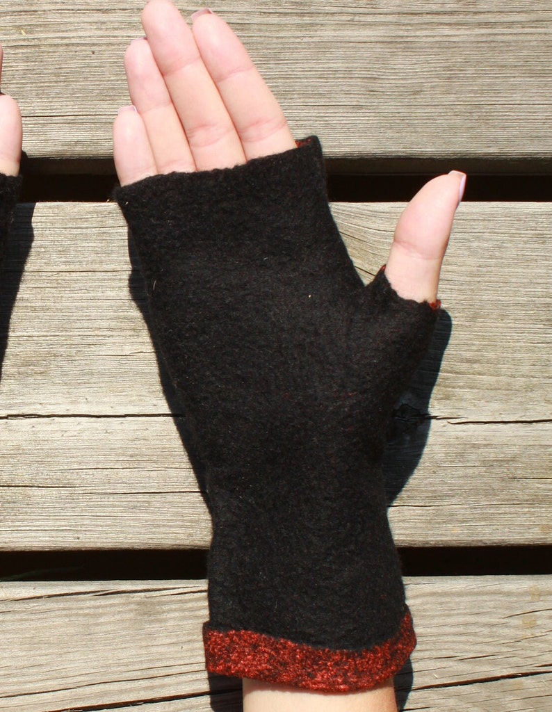 Black fingerless mitts were made of 100% merino wool.