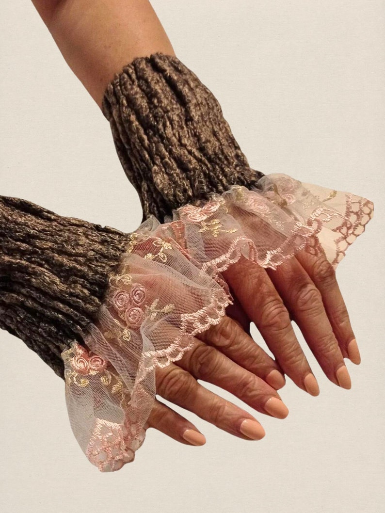 Hand warmers are designed with a minimalistic but elegant style, featuring luxury color - silver black. Arm warmers are finished with white mesh material embroidered with delicate pink flowers and green leaves.