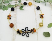 extravagante Statement Kette mit großen Kugeln in Erdtönen mit schwarz und gold