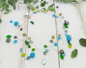 extravagante Statement Kette mit Blümchen, Blättern und Polarisperlen