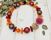 extravagante, üppige Statement Kette mit großen Kugeln, Polarisperlen, Resin, Puschel und Blumenscheiben