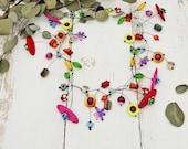 extravagante, kunterbunte Statement Kette mit Blümchen, Schmetterlingen und Polarisperlen