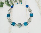 extravagante Statement Kette mit Perlmuttlinse und Glasperlen