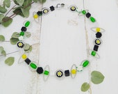Kette in kräftigen Farben mit Rosen und Polaris