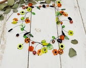 extravagante Statement Kette mit Blümchen, Schnecken und Polaris