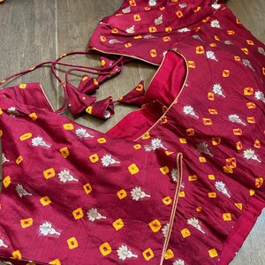Dark purple original bandhini dyed pure cotton unstitched salwar material, bead& faux mirror work on yoke(lining needed)matching original bandhini dyed pure cotton bottom, original bandhini dyed pure cotton dupatta. CODE MR253101 main image 0
