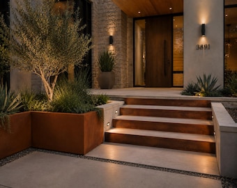 May include: A modern entryway featuring a set of wide, rusted metal steps leading to a dark wood door. The house number 3891 is mounted on the wall. Large rectangular planters made of rusted metal contain an olive tree and various green plants.