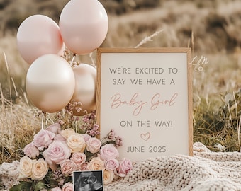 May include: A wooden sign with the text "We're excited to say we have a Baby Girl on the way! June 2025" in pink and brown lettering. The sign is surrounded by pink balloons, a bouquet of pink and yellow roses, and a framed ultrasound image.