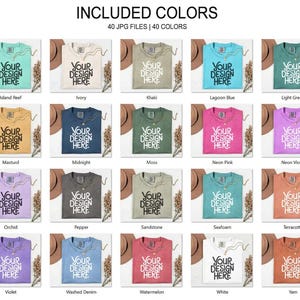 May include: A collection of 20 t-shirts in various colors, including Island Reef, Ivory, Khaki, and Lagoon Blue. Each shirt features the text "YOUR DESIGN HERE" in a white font. The image showcases a variety of colors and design options.