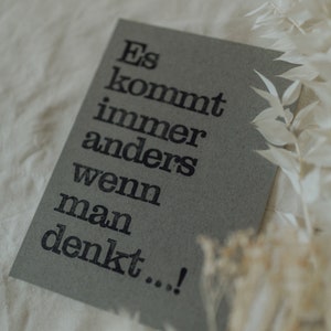 Postkarte "Es kommt anders" gestempelter Spruch