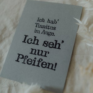 Postkarte "Tinnitus im Auge" gestempelter Spruch