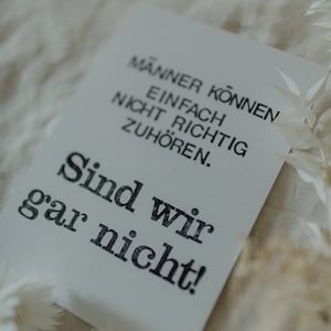 Postkarte "Männer können nicht zuhören" gestempelter Spruch