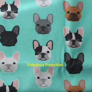 May include: A teal fabric featuring a repeating pattern of French Bulldog faces in various colors, including black, brown, gray, and white. The text "Fabulous Frenchies" is printed on the fabric.